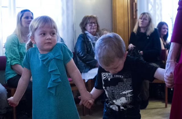 Toddler Henny in a blue dress